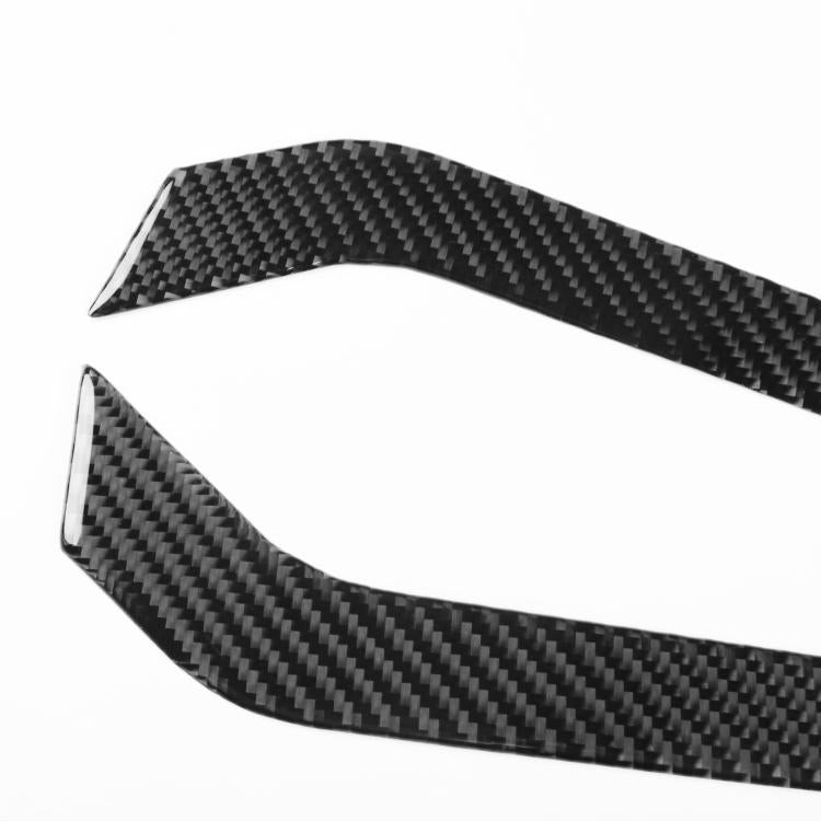Black carbon-fiber style curved door armrest decorative sticker piece.