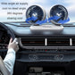 Double-head car fan mounted on a dashboard vent area with wide airflow coverage