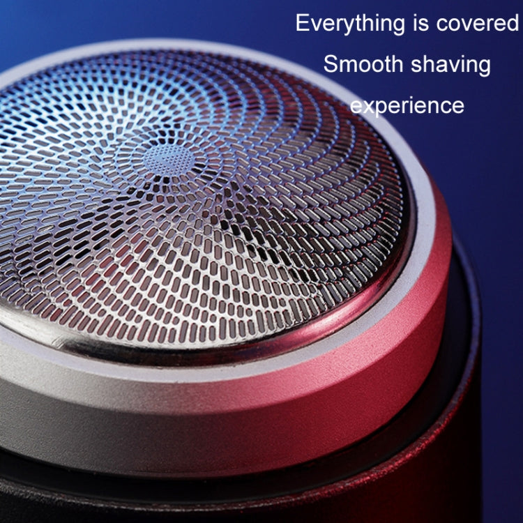 Electric shaver foil head close-up with red trim around the cutter