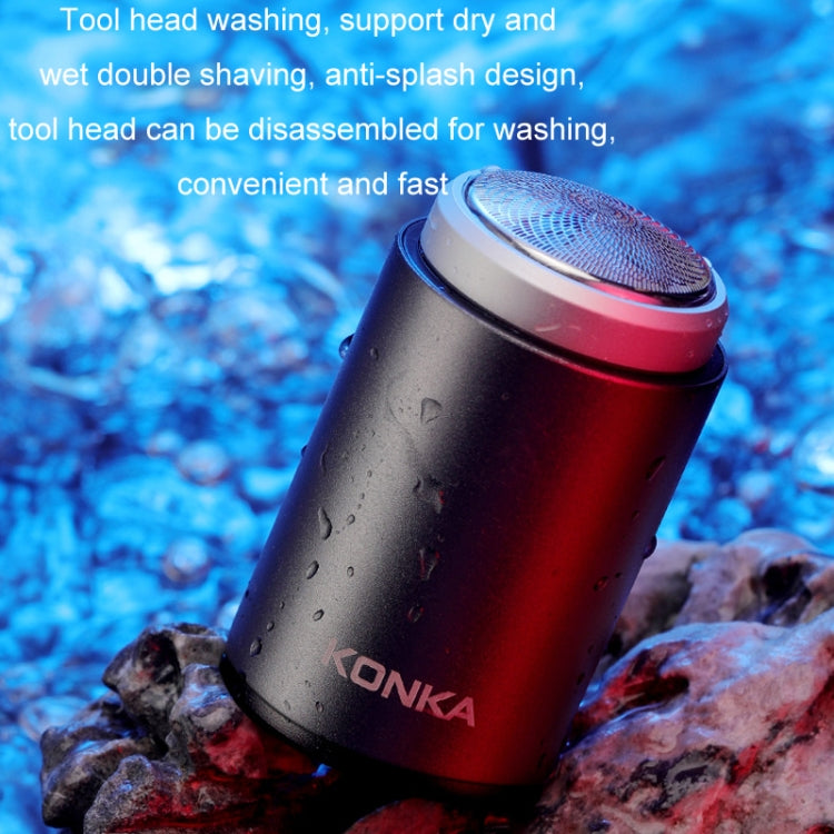 Waterproof portable electric shaver with red body and round foil head