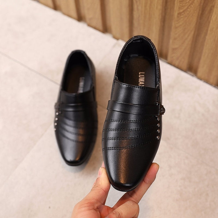 Children's black leather loafers, pointed toe with buckle strap and seam detailing