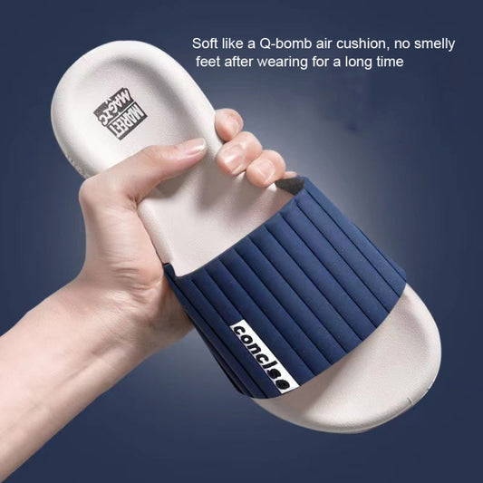 Men's and women's navy slide slippers with ribbed strap and soft white footbed