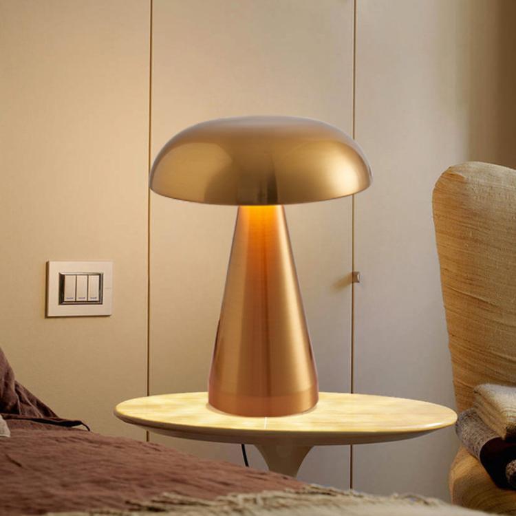 Gold mushroom bedside table lamp with domed shade and tapered stem