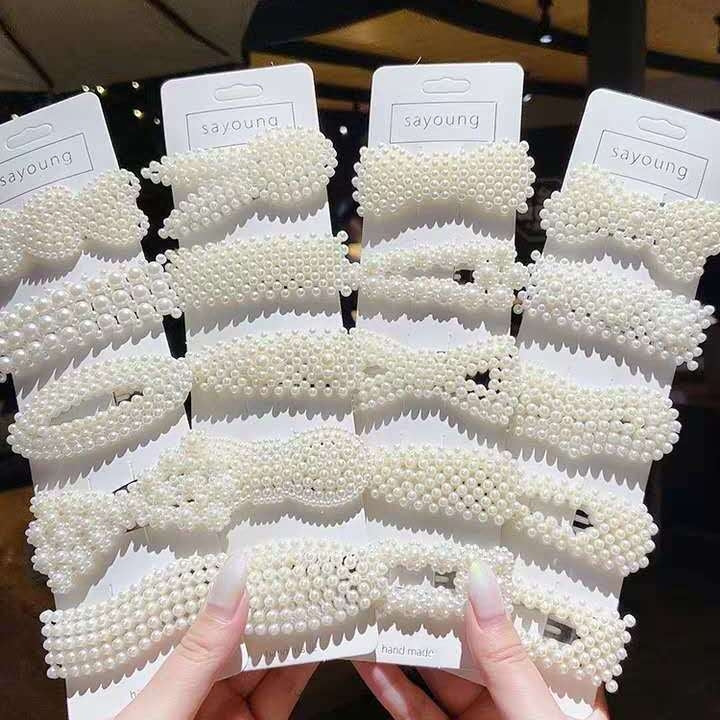 Set of large pearl hair clips on display cards with scalloped bead design