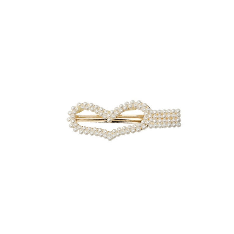 Single pearl barrette hair clip with gold-tone prongs and bead embellishment