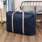 Navy moving storage duffle bag with beige center strap and top carry handles