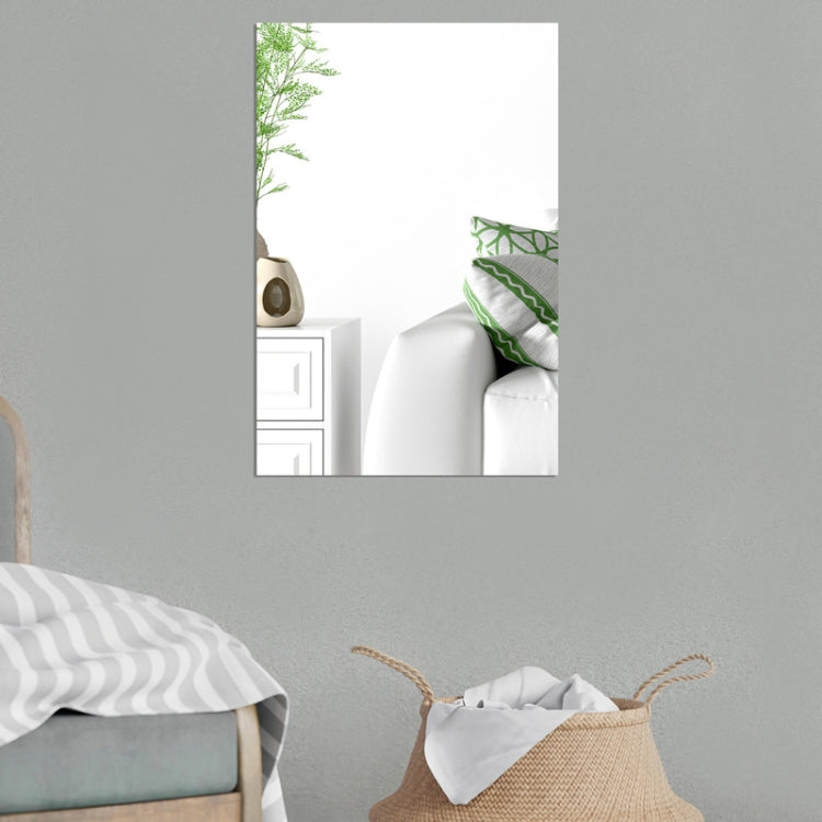 Set of 4 rectangular acrylic mirror wall stickers on a wall above a bed