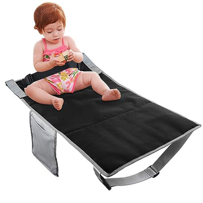 Black kids airplane seat extender cushion with securing straps and soft padded surface