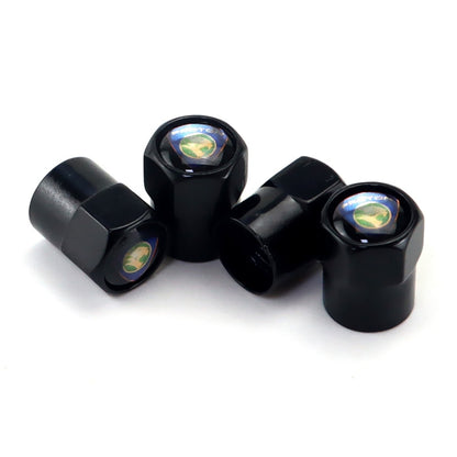 Set of 4 black metal tire valve caps with labeled emblem, anti-theft hex design