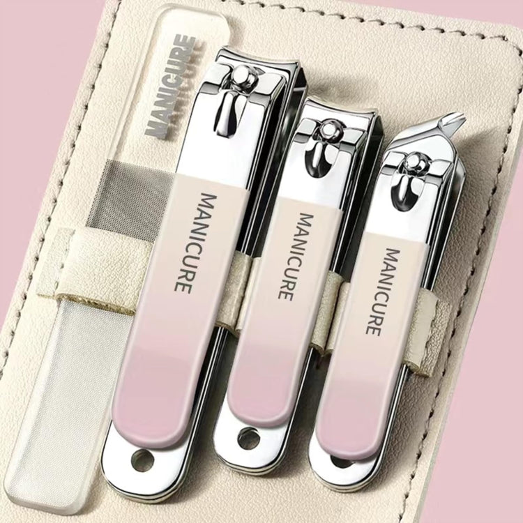 Stainless steel nail clipper set with light pink handles, three clippers in white case