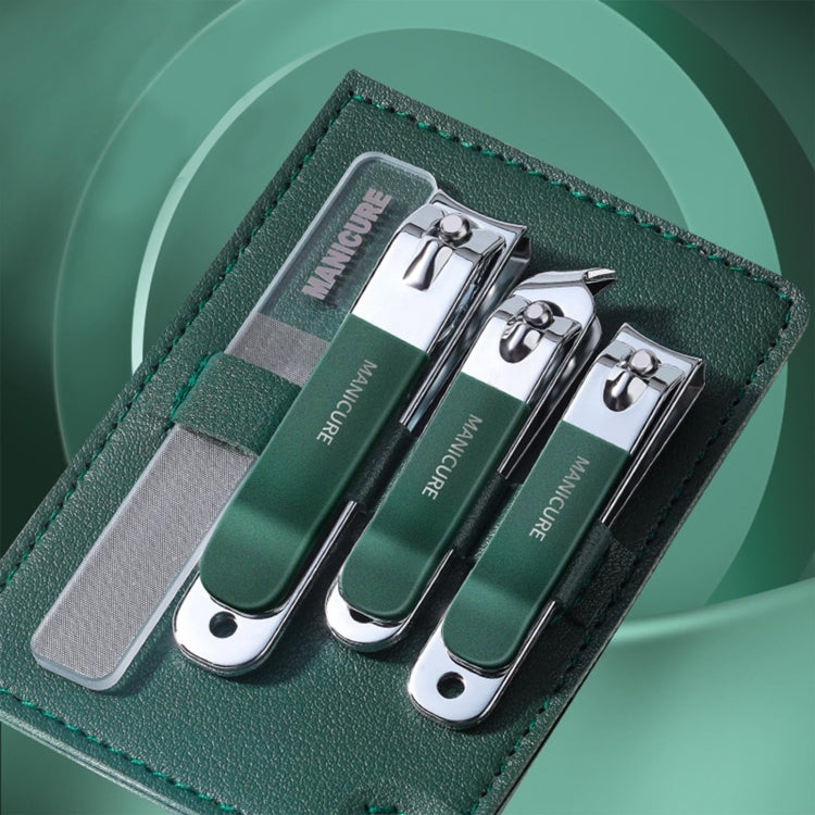 Stainless steel nail clipper set with dark green handles, three clippers in green pouch
