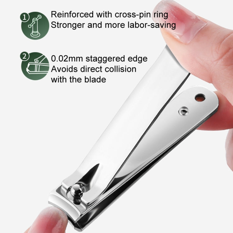 Stainless steel nail clipper with beveled jaw and light pink base, held by a hand