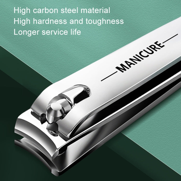 Stainless steel nail clipper with curved cutter lever and green panel, close-up
