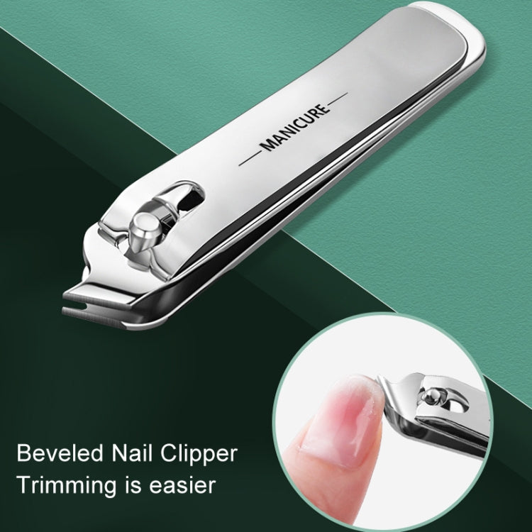 Beveled stainless steel nail clipper with white handle and green panel, finger close-up