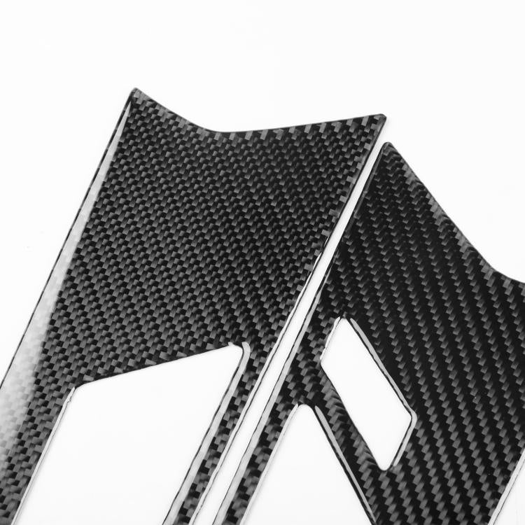 Set of 4 carbon-fiber look door handle trim stickers, black, close-up.