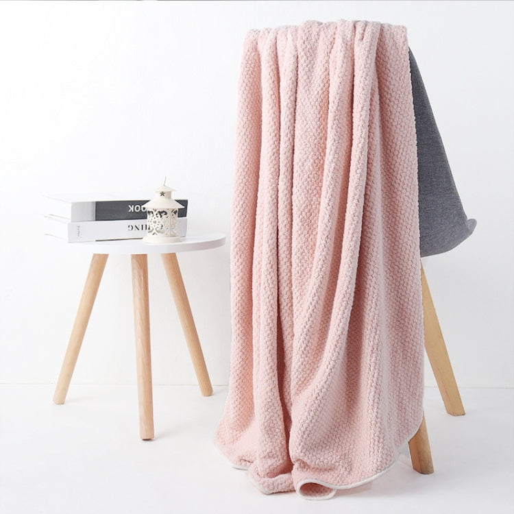 Light pink bath shower towel with waffle texture, full drape view