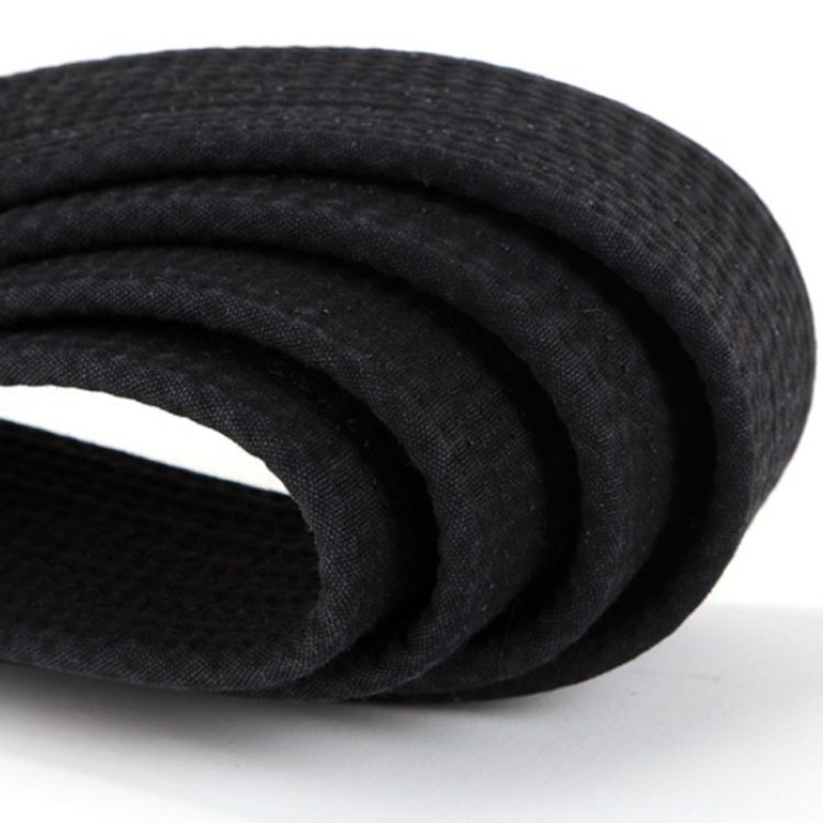 Black taekwondo waist belt, woven texture close-up