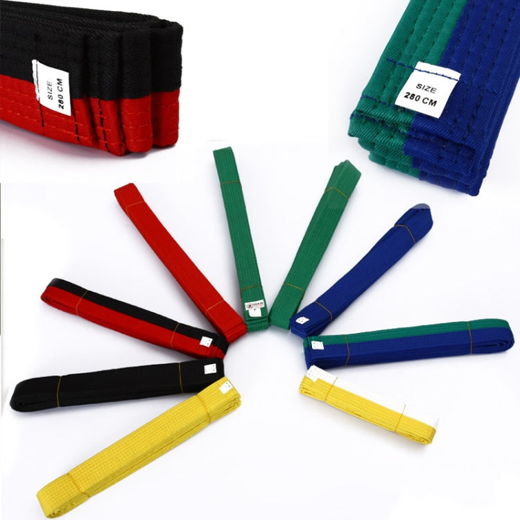 Assorted taekwondo belts with labels: red, green, blue, black