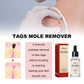 Gloved hand using mole remover serum; Skin-Clear bottle and red package box