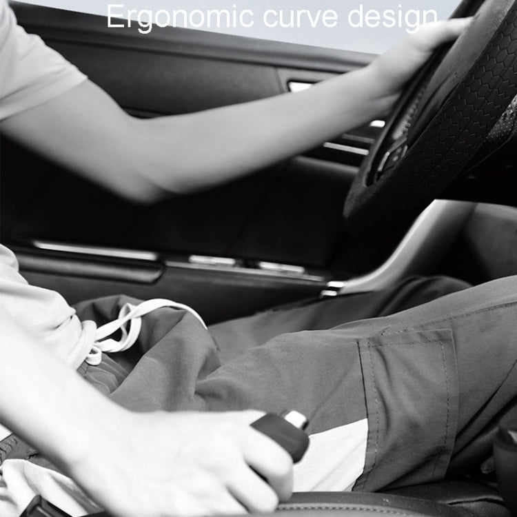 Black silicone handbrake handle cover with textured grip, installed on car center console