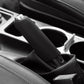Black silicone handbrake handle cover, close-up showing sleeve fit on vehicle interior