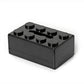 Black building-block tissue storage box with round studs and tissue slot