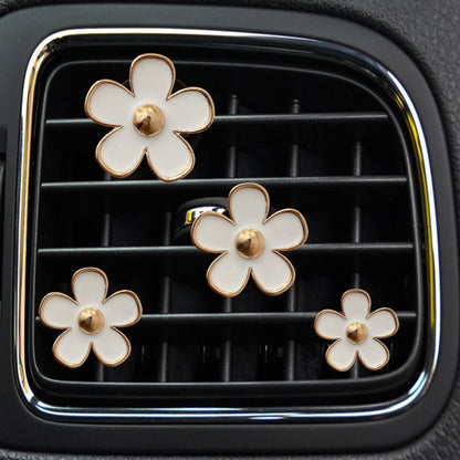 Chrysanthemum air vent clip decoration set with white enamel flowers and gold centers