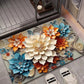 Floral diatom mud absorbent floor mat with large white, blue, and orange 3D blossoms