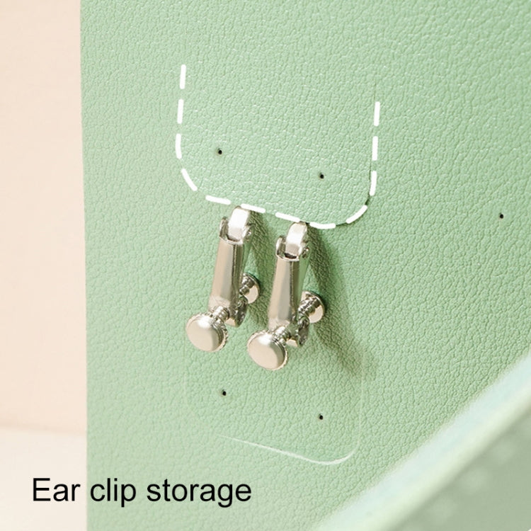 Green jewelry bag with metal clip holders for storing earrings and ear clips securely