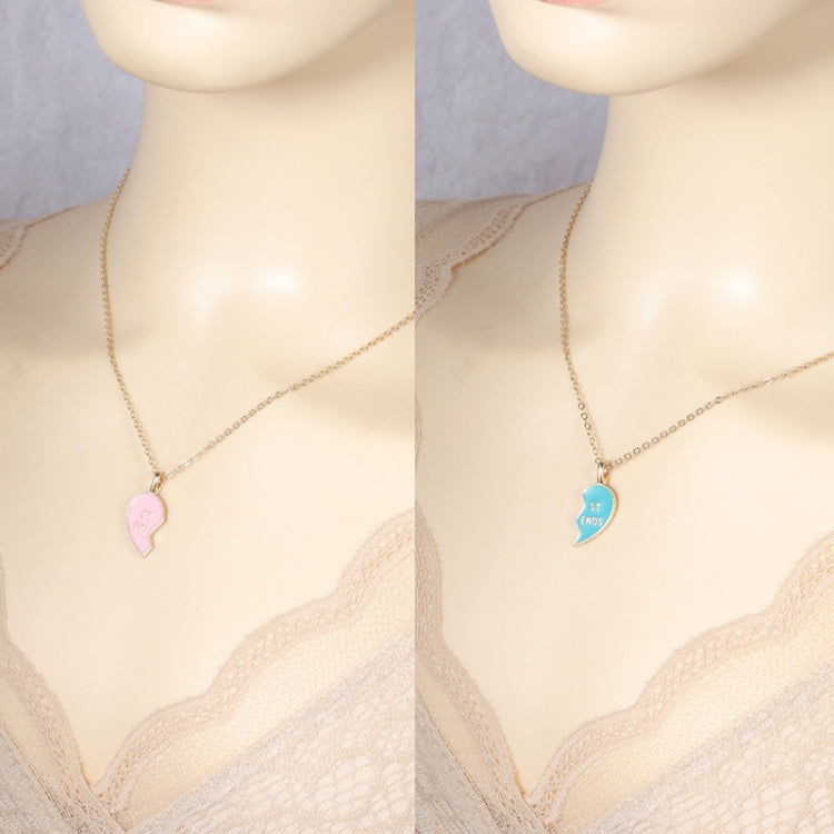 Gold-tone heart pendant necklace with pink and blue lock hearts on chain