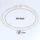 Layered gold-tone chain necklace with pink and blue heart pendants