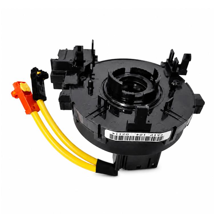 Clock spring coil assembly with black circular case and yellow cable, orange plug
