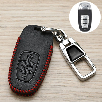 Black leather key fob cover with red stitching, metal ring, and remote button icons