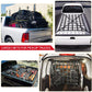 Black pickup cargo net installed over the truck bed with strapped attachment