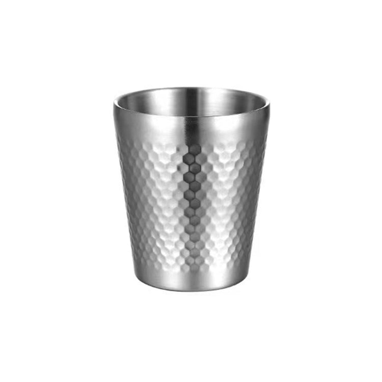 Silver hammered metal tea mug with vertical dot pattern, round rim, no handle