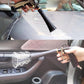 Car interior cleaning gun spraying mist toward dashboard and seat