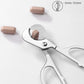 Stainless steel pill cutter with 5–15mm cutting range shown and silicone case
