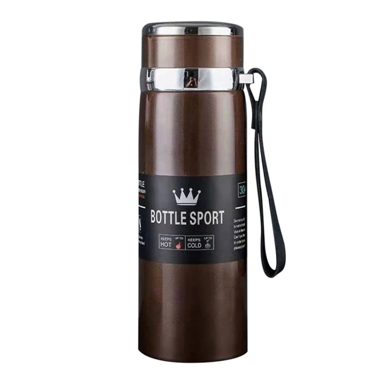 Brown vacuum insulated stainless steel mug with metal lid, front label, and wrist strap