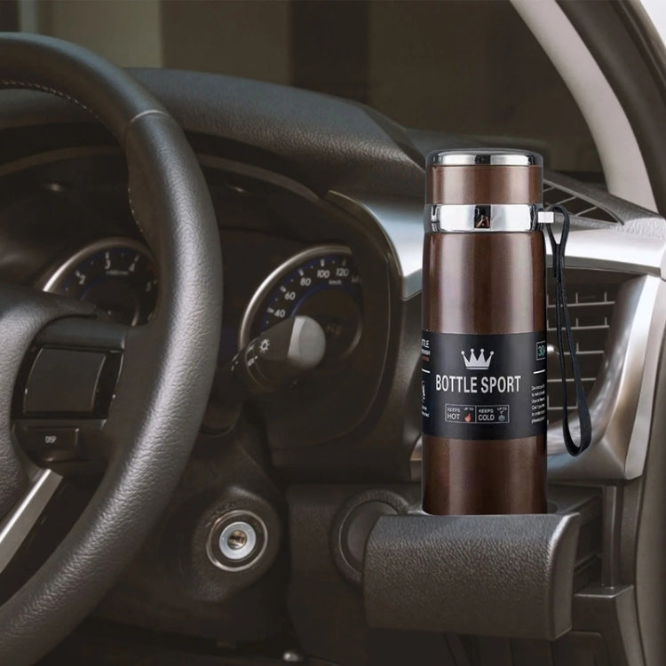 Vacuum insulated mug with stainless steel lid and dark band, on-the-go handle strap