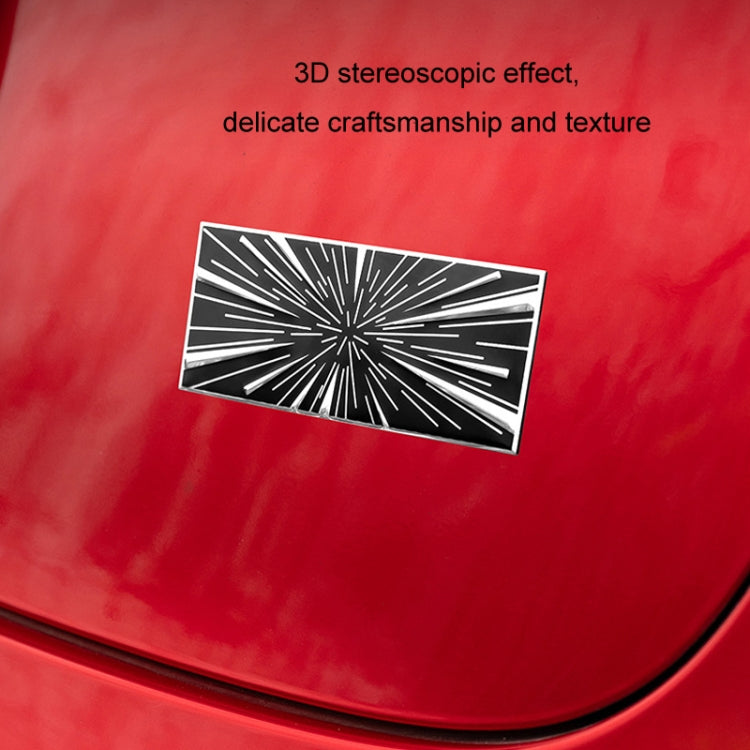 Metal car tail decoration label on red surface, rectangular time tunnel starburst design
