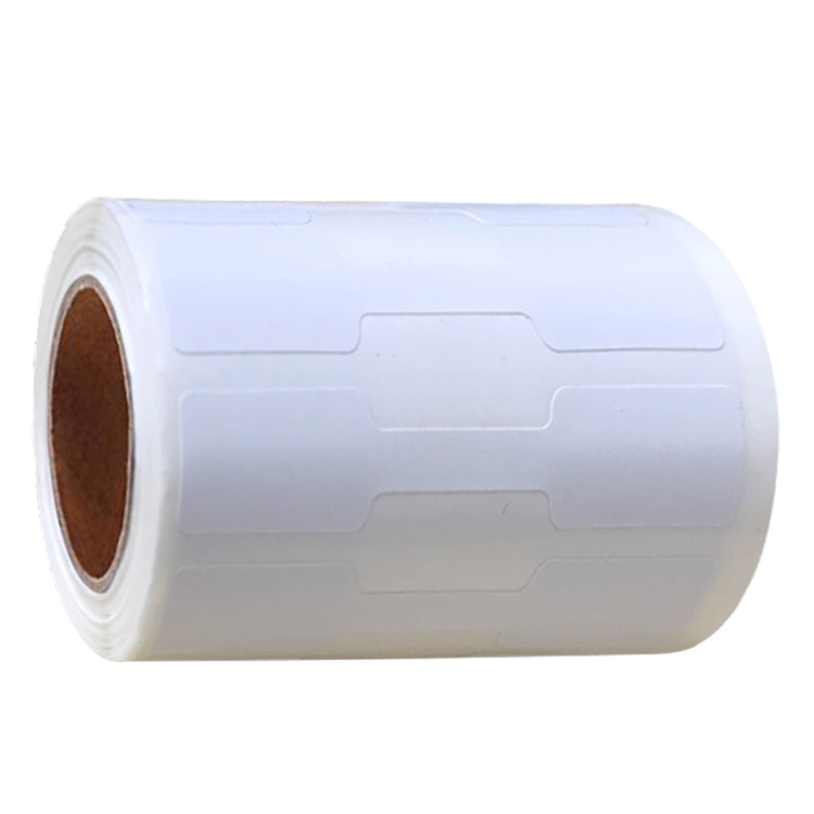 Roll of white price stickers with gold backing and blank label outlines