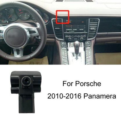 Black car phone navigation holder base mount shown on Porsche dashboard center area
