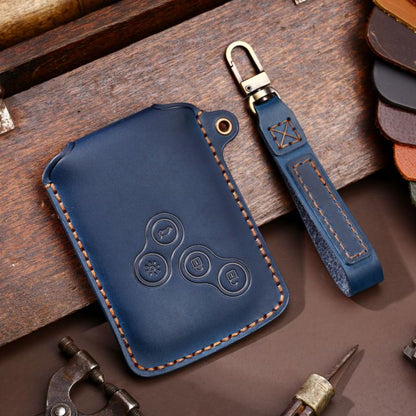 Blue leather car key case with embossed remote buttons and stitched edges