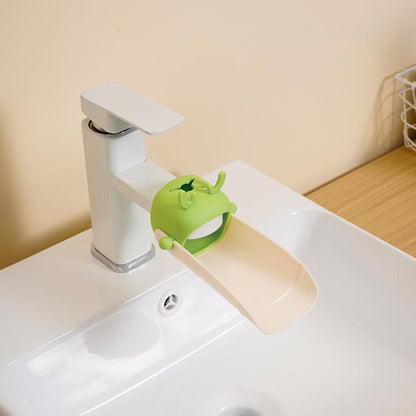 Deer-shaped green faucet extender diverter for kid-friendly splash control.