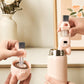 Rabbit-shaped cup and crevice cleaning brush with clear bristles and blush-pink handle