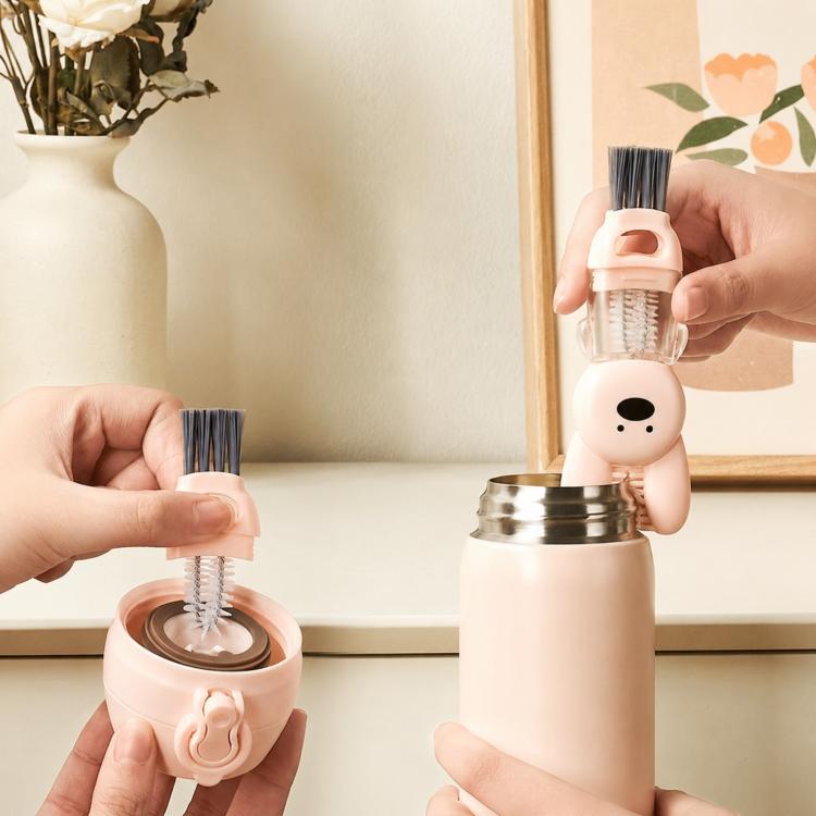 Rabbit-shaped cup and crevice cleaning brush with clear bristles and blush-pink handle