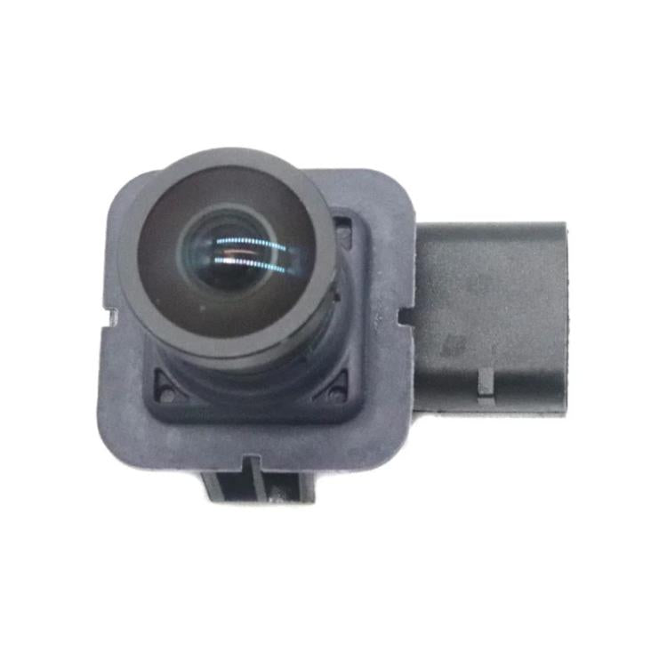 Rear view reversing camera module with circular lens and side electrical connector