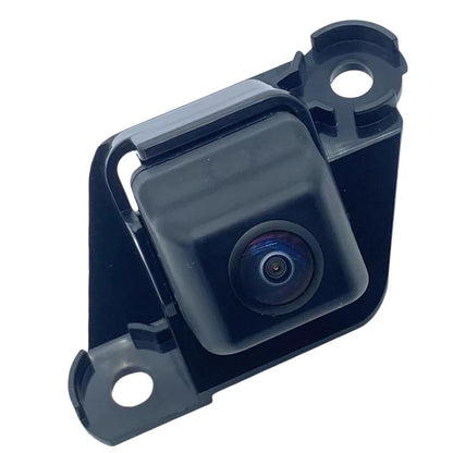 Rearview reverse assist camera module with dark plastic housing and lens