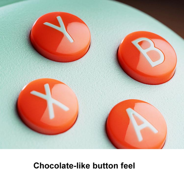 Wireless gaming controller buttons: four orange face buttons with white symbols