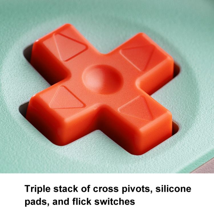 Wireless gaming controller D-pad close-up, orange cross on textured surface